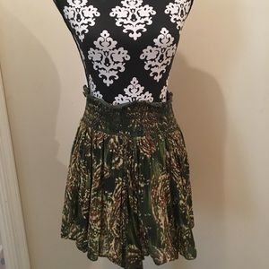 Medium, high-waisted, green skirt.